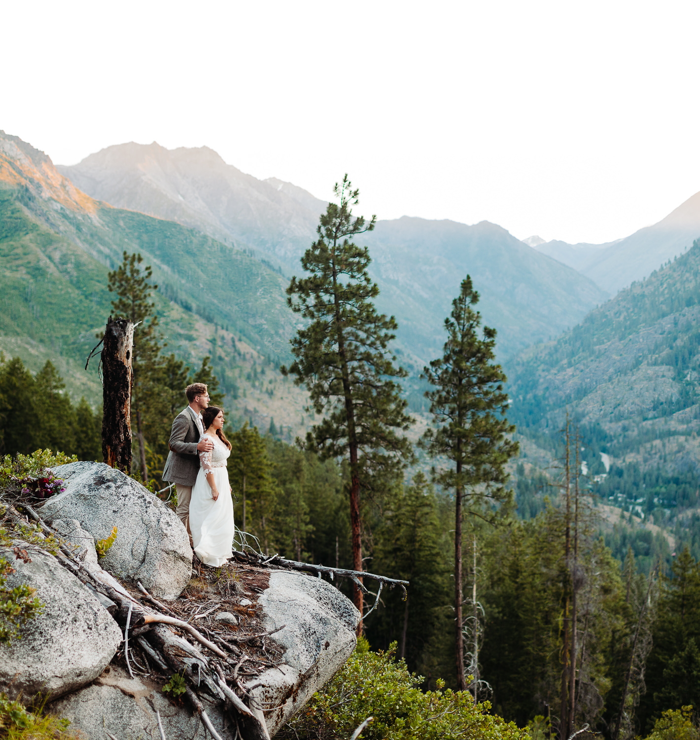 Couple posing on a mountian. Taken by Portland Wedding Photographer Nate Meeds
